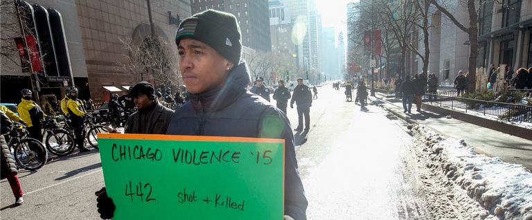 Demonstrators calling for an end to gun violence and the resignation of Chicago Mayor Rahm Emanuel march through downtown on December 31, 2015 in Chicago, Illinois.