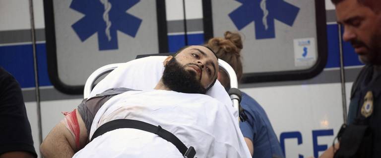 Ahmad Khan Rahami is taken into custody after a shootout with police Monday, Sept. 19, 2016, in Linden, N.J.