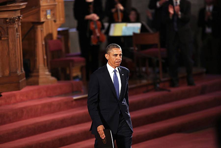President Barack Obama exits after speaking at an interfaith prayer service for victims of the Boston Marathon attack titled "Healing Our City," at the Cathedral of the Holy Cross on April 18, 2013 in Boston, Massachusetts.(Spencer Platt/Getty Images)
