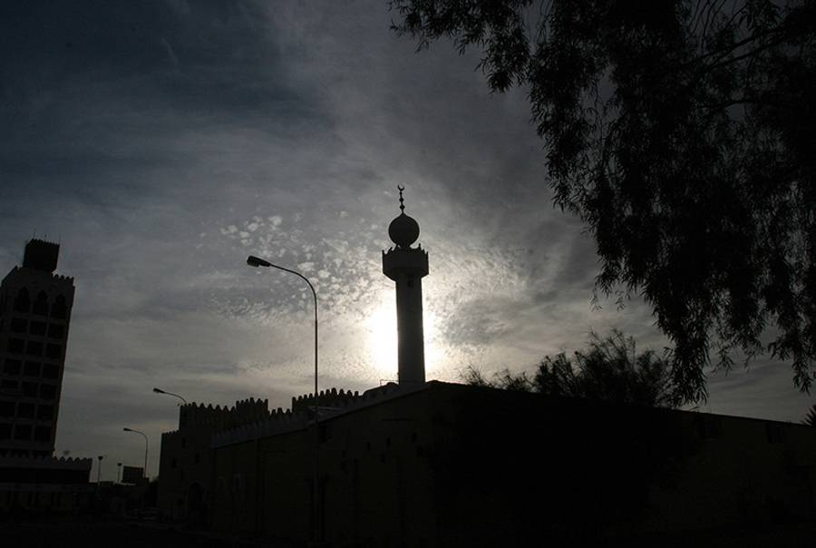 The sun sets behind a mosque in the Saudi city of Hael on June 2, 2007.(Hassan Ammar/AFP/Getty Images)