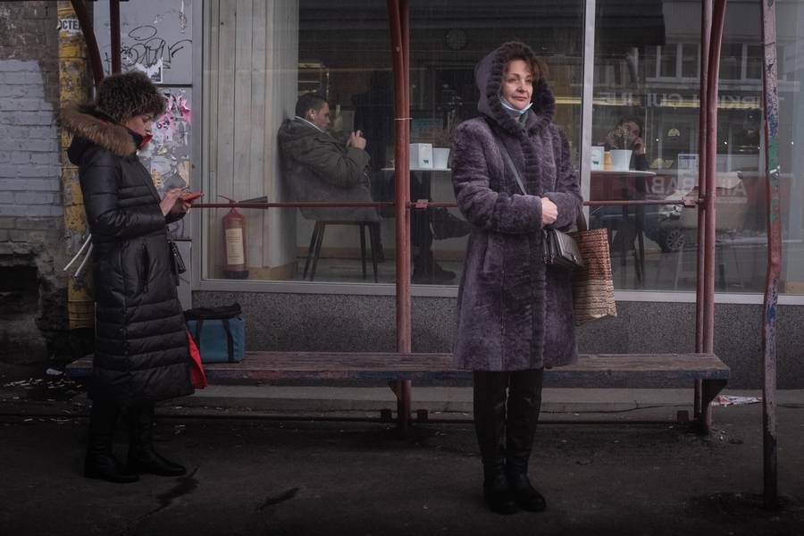 Women wait for a bus in Kyiv, Ukraine, on Feb. 2, 2022