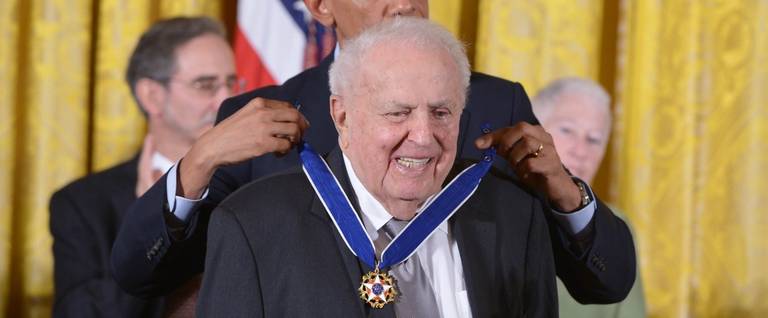 U.S. President Barack Obama presents the Medal of Freedom to former U.S. Representative Abner Mikva during a ceremony at the White House in Washington, D.C., November 24, 2014. 