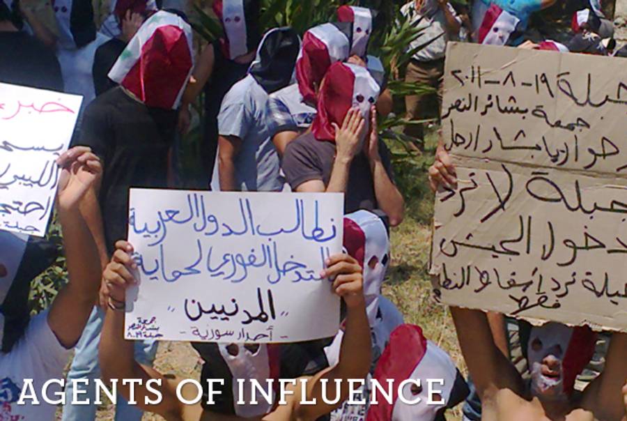 Syrian anti-government protesters in the coastal town of Jableh this summer.(AFP/Getty Images)