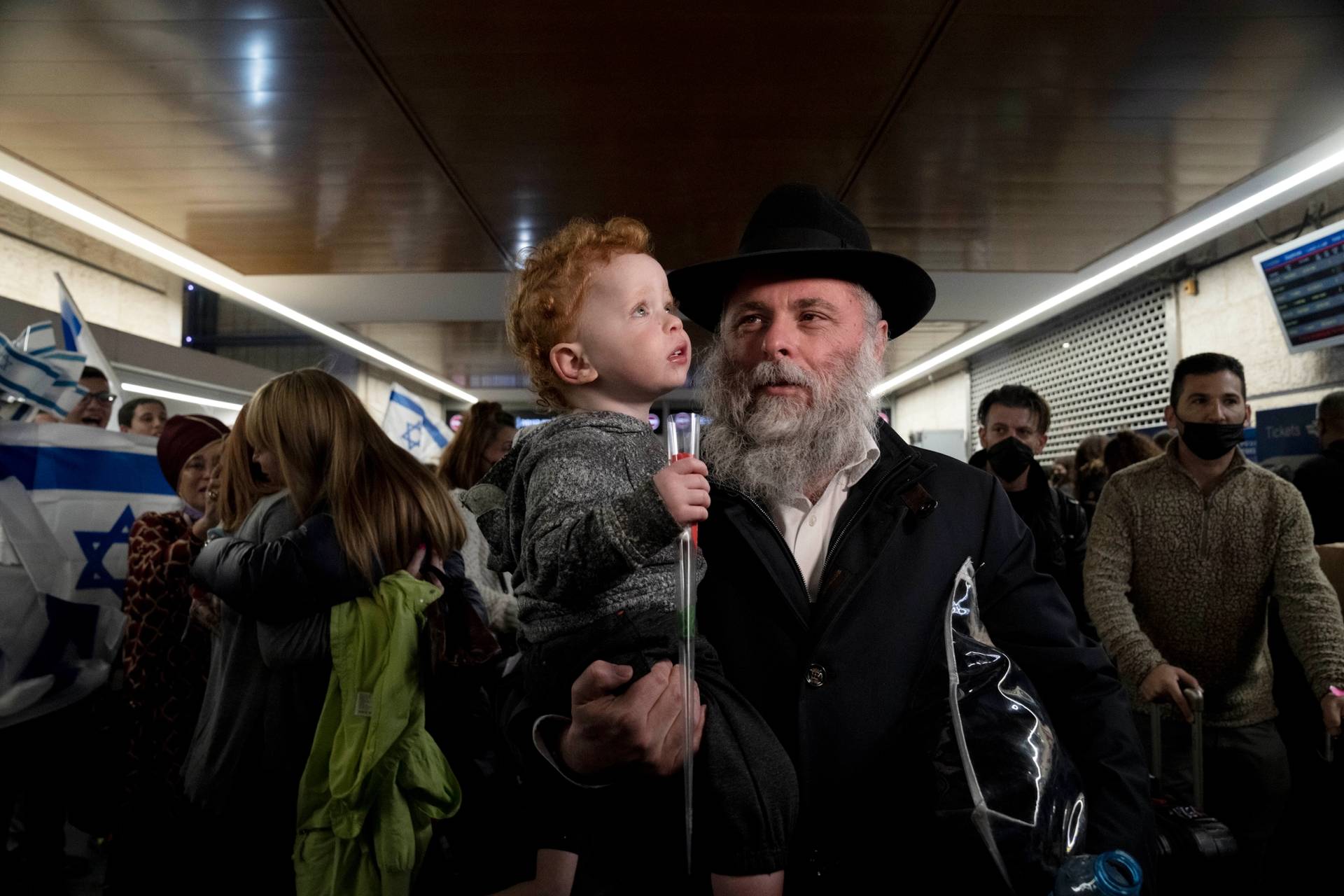 Chief rabbi of Kyiv, Yonatan Markovich, arrives at Ben-Gurion Airport with family from Ukraine on March 3, 2022. Some estimates say 10,000 Ukrainian Jews will come to Israel to escape the Russian invasion; others predict 10 times that.