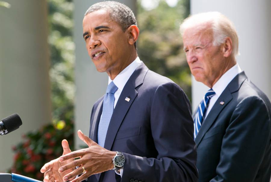 U.S. President Barack Obama (L) joined by Vice President Joe Biden delivers a statement on Syria in the Rose Garden of the White House on August 31, 2013 in Washington, DC.(Kristoffer Tripplaar-Pool/Getty Images)
