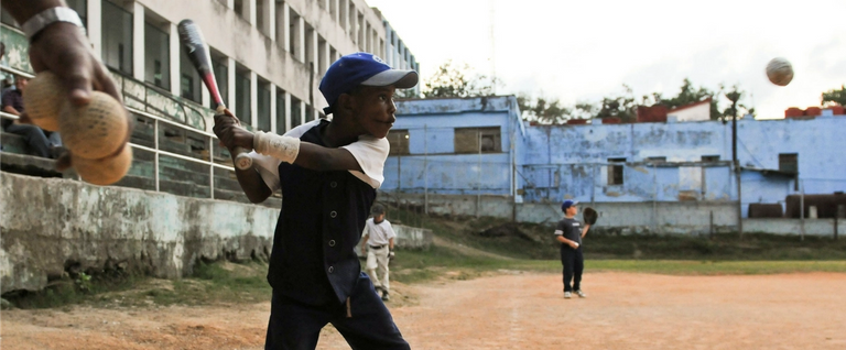 Cuban children play baseball in Havana, on March 16, 2016. 