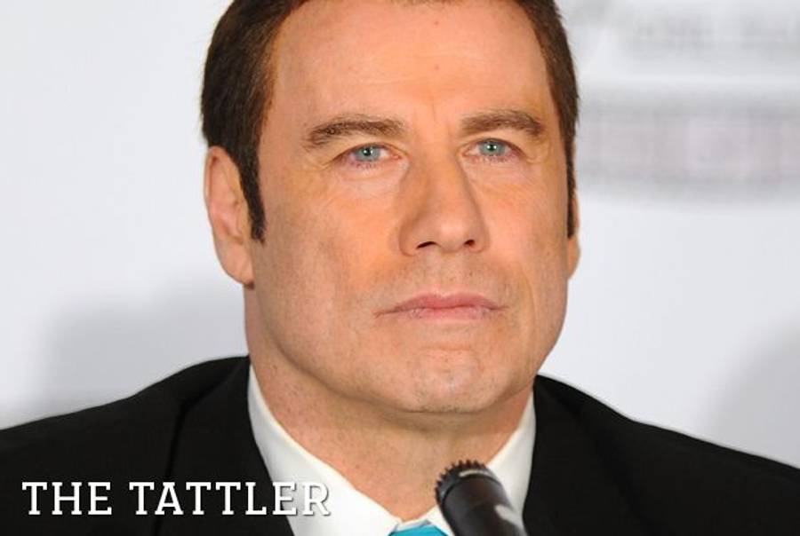 John Travolta at a press conference on April 12, 2011, in New York City.