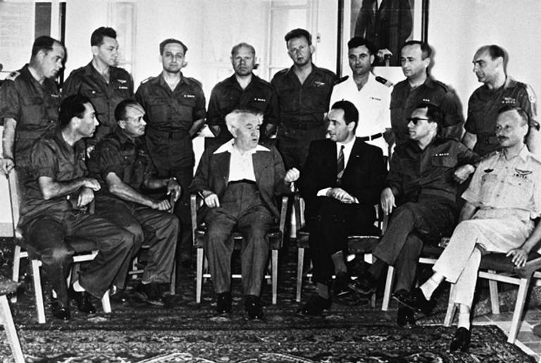 Prime Minister David Ben-Gurion with the Israel Defense Forces senior staff, Shimon Peres, Moshe Dayan, and Yitzhak Rabin, 1953.(Government Press Office, State of Israel)