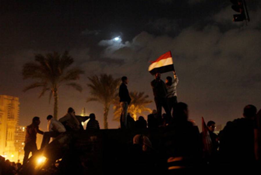 Jubilant Egyptians on February 11.(All photos by Chris Hondros/Getty Images)