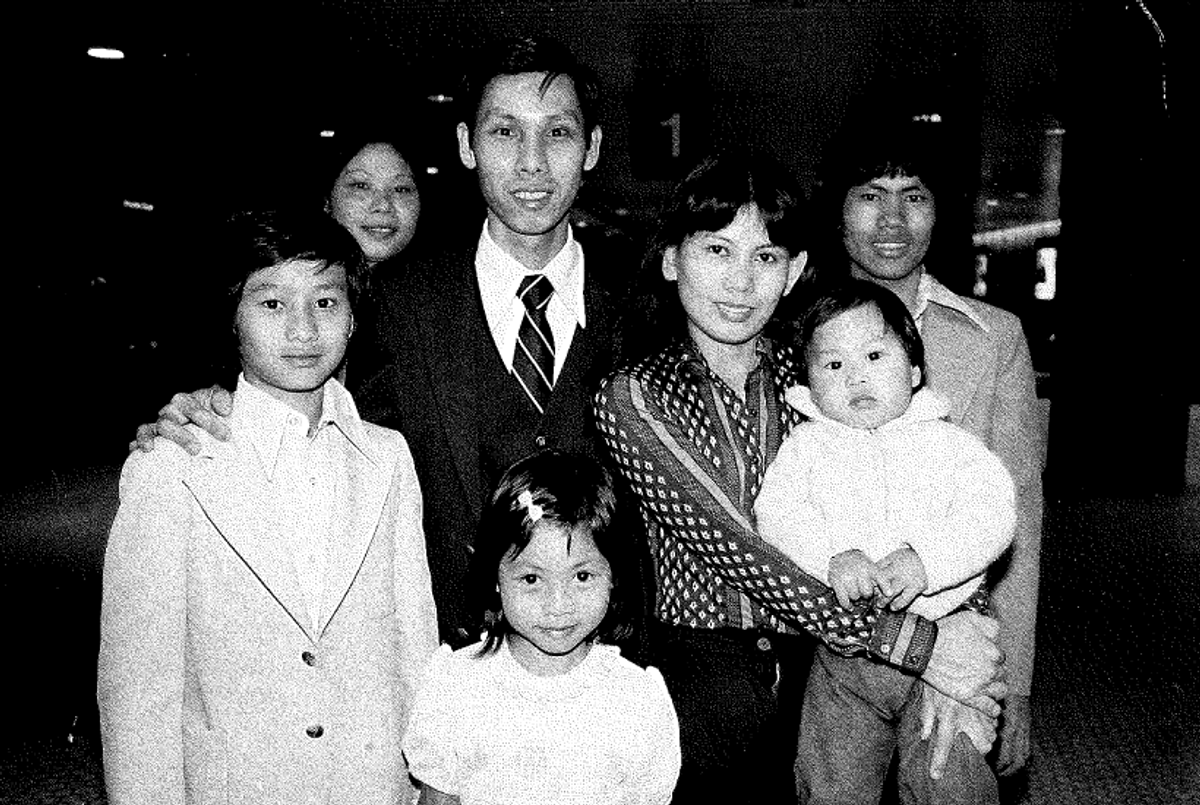 From left: Tai Khai Huyn; Muoi Truong; her brother Tai, with his daughter Lisa standing in front of him and his wife, Tu Anh Tran, holding their son Lap Tri Truong; Tu Anh's brother, Phuc Tran, in the early 1980s at Baltimore-Washington International Airport. (Baltimore Hebrew Congregation)