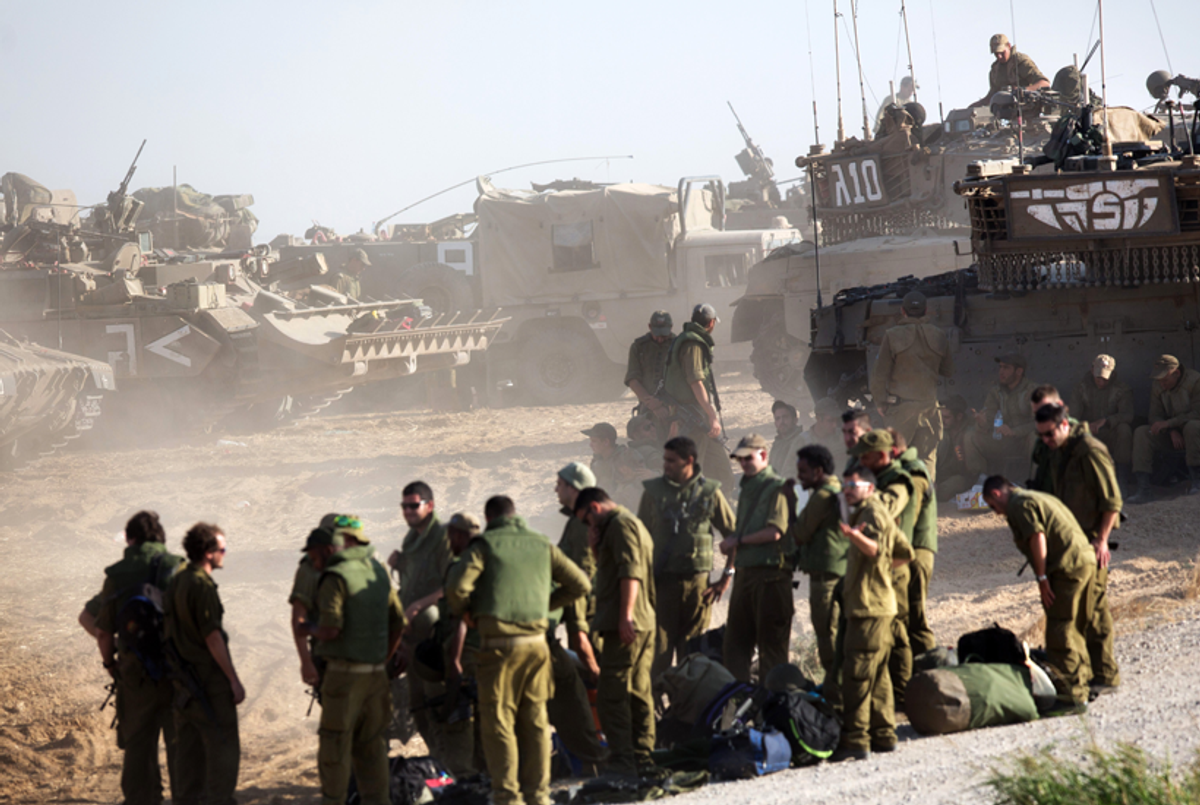 Israeli soldiers gather in an army deployment area near Israel's border with the Gaza Strip on July 10, 2014. (Menahem Kahana/AFP/Getty Images)
