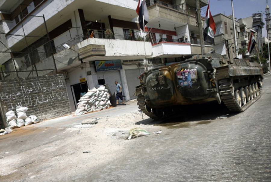A Syrian tank in the city of Homs.(Joseph Eid/AFP/Getty Images)