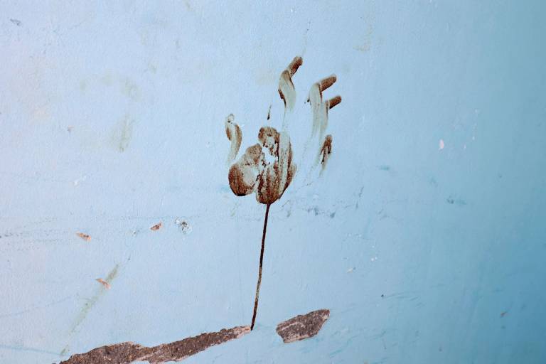 A bloody handprint inside a house at the Nir Oz kibbutz, one of the Israeli communities near the Gaza Strip attacked on Oct. 7 by the Palestinian militant group Hamas, on Oct. 31, 2023