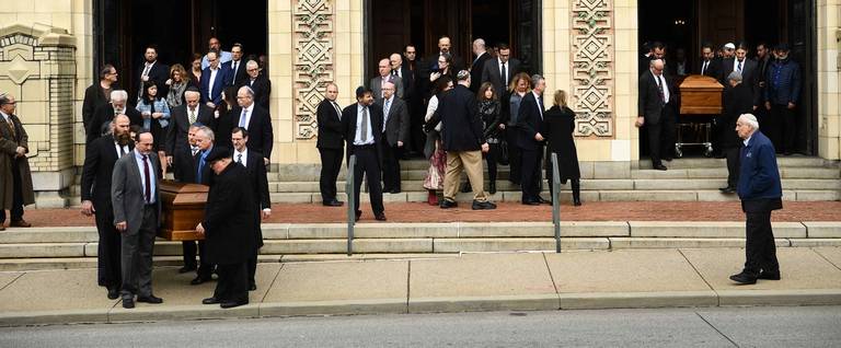 Caskets are carried outside Rodef Shalom Congregation where the funeral for Tree of Life mass shooting victims Cecil Rosenthal and his brother David Rosenthal was held Oct. 30, 2018 in Pittsburgh.