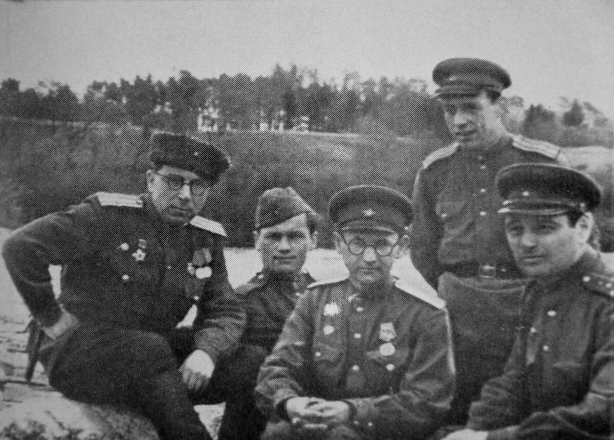 Ilya Selvinsky, left, Yakov Khelemsky, center, with fellow servicemen, Kurland, May 1945
