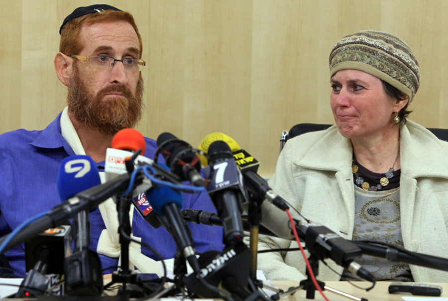 Rabbi Yehuda Glick and his wife Yaffa during a press conference at Shaare Zedek hospital in Jerusalem, on Nov. 24, 2014. (Gil Cohen Magen/AFP/Getty Images)