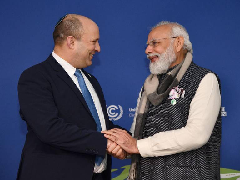 Israeli Prime Minister Naftali Bennett and Indian Prime Minister Narendra Modi shake hands at the COP26 climate conference in Glasgow, Nov. 1, 2021