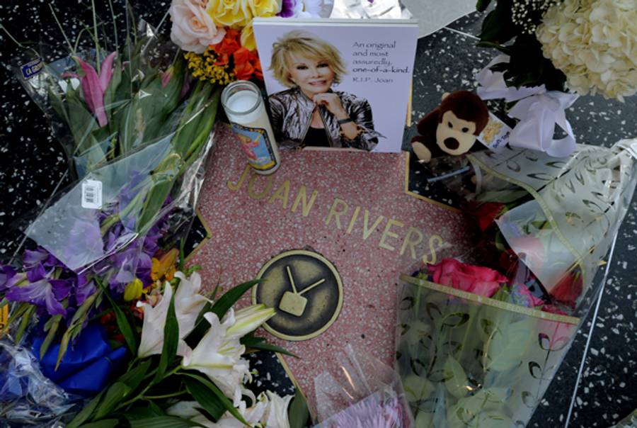 Flowers are placed on the Hollywood Walk of Fame Star for Joan Rivers in Hollywood, California on September 4, 2014, following news of the comedian's death in New York at the age of 81. (MARK RALSTON/AFP/Getty Images)