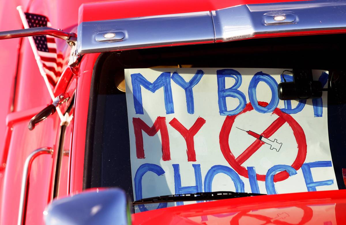  A 'My Body My Choice' sign is displayed in a truck as truck drivers and supporters gather before a ‘People’s Convoy’ departs for Washington, D.C., to protest COVID-19 mandates on Feb. 22, 2022, in Adelanto, California
