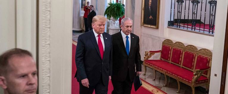 Donald Trump and Benjamin Netanyahu arrive to a joint statement in the East Room of the White House on Jan. 28, 2020. The news conference was held to announce the Trump administration's plan to resolve the Israeli-Palestinian conflict.
