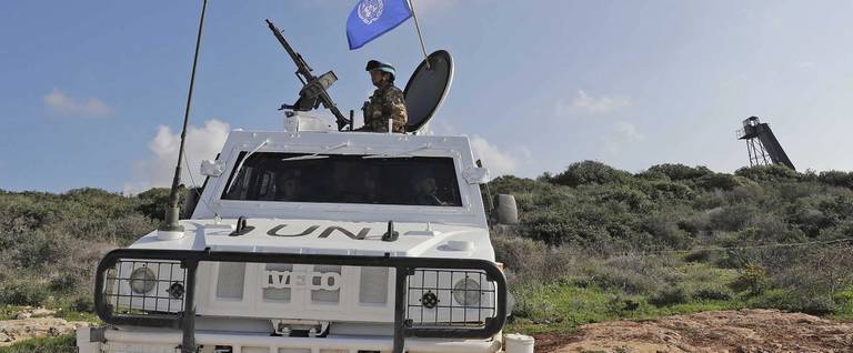 Soldiers form the Italian contingent in the UNIFIL patrol the blue line in Lebanon's southern border town of Naqura on the border with Israel, south of Beirut, on February 24, 2018. The UN peacekeeping force in southern Lebanon has made efforts to prevent tension between Lebanon and Israel from escalating into a conflict, warning of continued escalation on the backdrop of oil exploration and construction of a barrier on the border.
