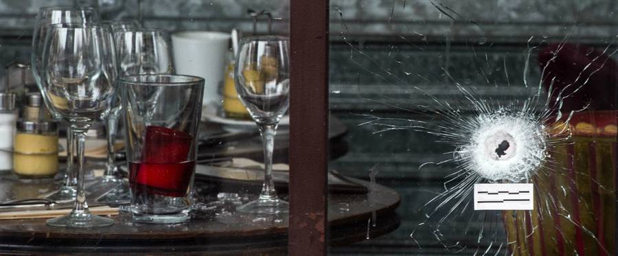 Bullet holes and marks are seen on the windows of the Cafe Bonne Biere restaurant in Paris, France, November 14, 2015. 