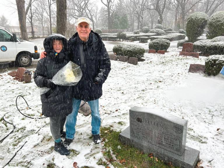 Members of the Philos Action League at a vandalized Jewish cemetery in Waukegan, Illinois, November 2022. PAL volunteers bring white roses as a symbol of allyship.