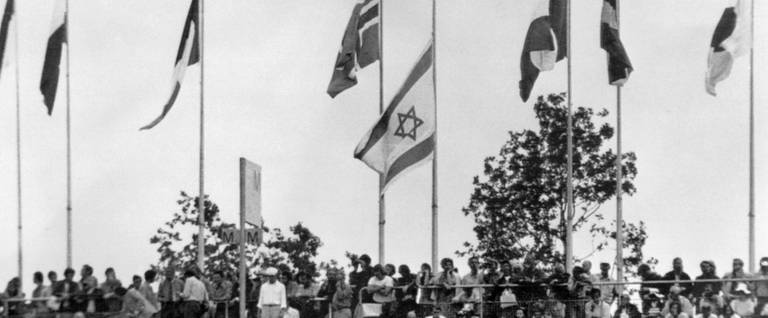 The Israeli flag flies at half-mast among national flags displayed at the Munich Olympic Stadium, September 10, 1972. 