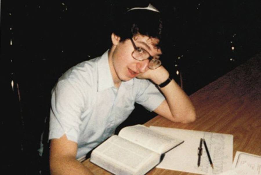 The author crams at the last minute before the National Bible Contest in New York in 1983, wearing the Chidon's trademark blue and white yarmulke. 