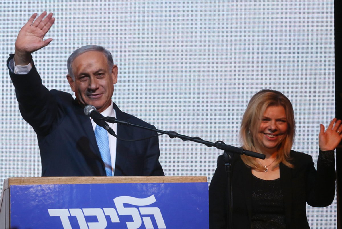 Israeli Prime Minister Benjamin Netanyahu and his wife Sara wave to supporters on March 17, 2015, in Tel Aviv. (Menahem Kahana/AFP/Getty Images)