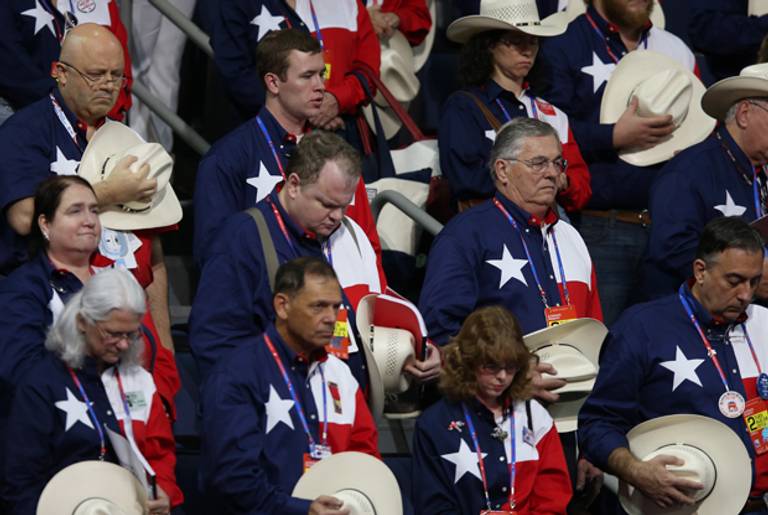 People from the Texas delegation bow their heads during the second day of the Republican National Convention on August 28, 2012 in Tampa, Florida. (Mark Wilson/Getty Images)