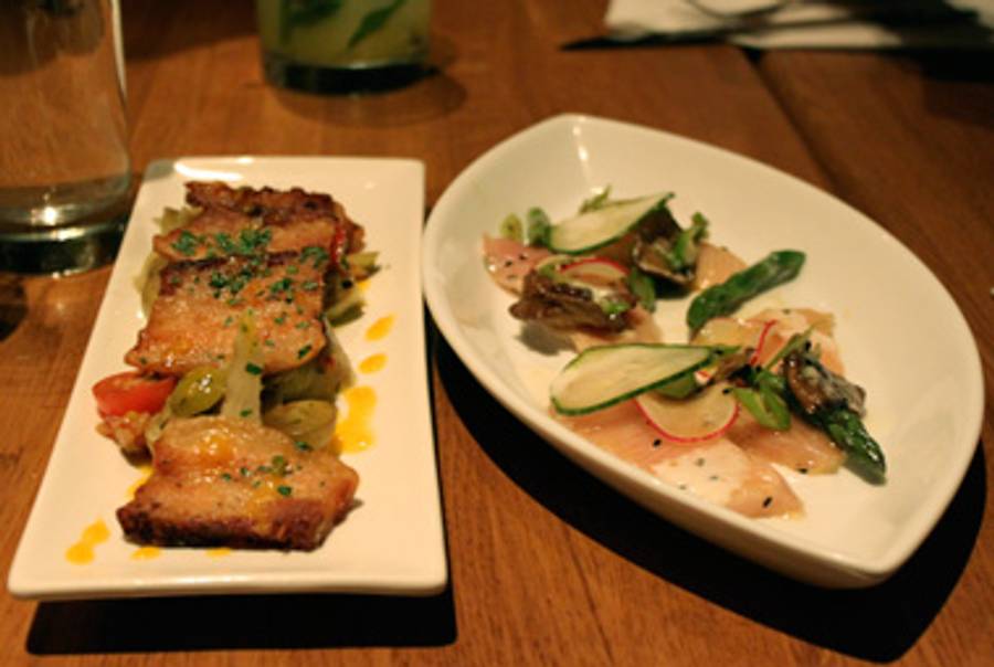 Traif's crispy pork belly with braised artichokes and muscat grapes; marinated yellowtail with asparagus, meyer lemon, and shiitake.(Kim Davidson)