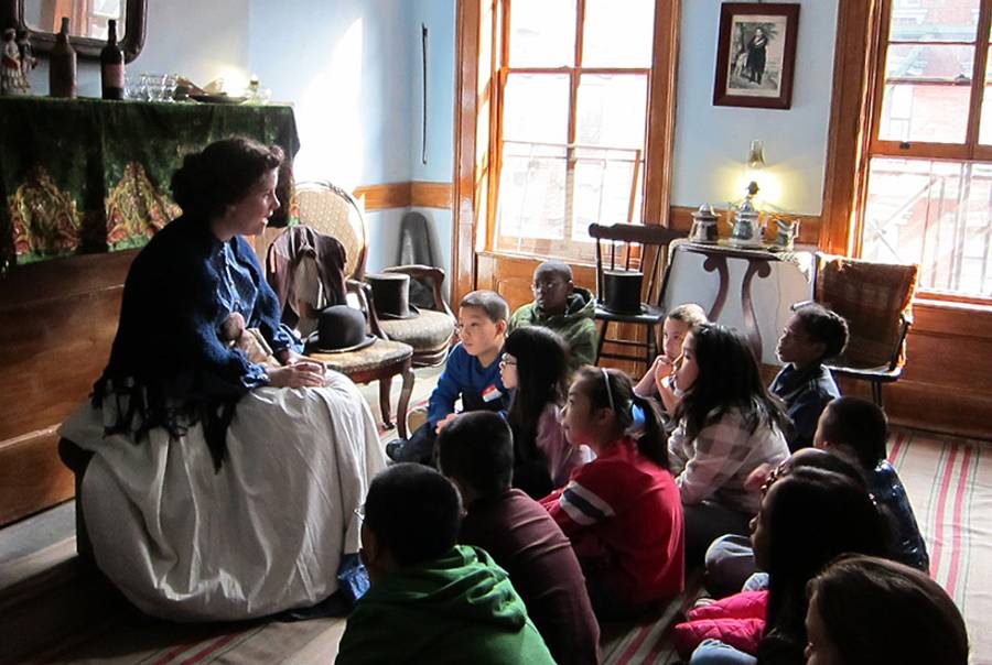 A costumed interpreter portrays Bridget Moore in a program for school groups at the Tenement Museum.(Courtesy of the Tenement Museum)