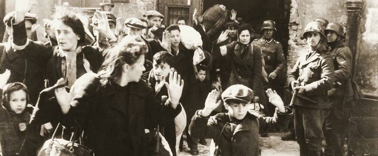 Warsaw Ghetto Uprising, May 1943. The original German caption reads: 'Forcibly pulled out of dugouts.'