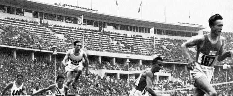 Finnish champion Volmari Iso-Hollo (R) leads the 3000m steeplechase to win the gold medal at the Berlin Olympics in Berlin, Germany, August 7, 1936. 