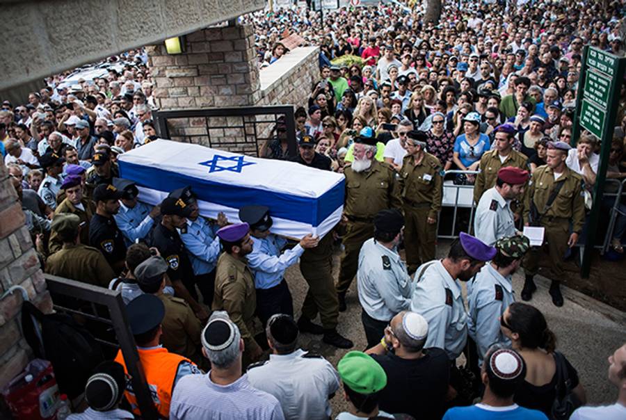 An honor guard caries the coffin of Israeli Lt. Hadar Goldin during his funeral on August 3, 2014 in Kfar-saba, Israel. (Ilia Yefimovich/Getty Images)