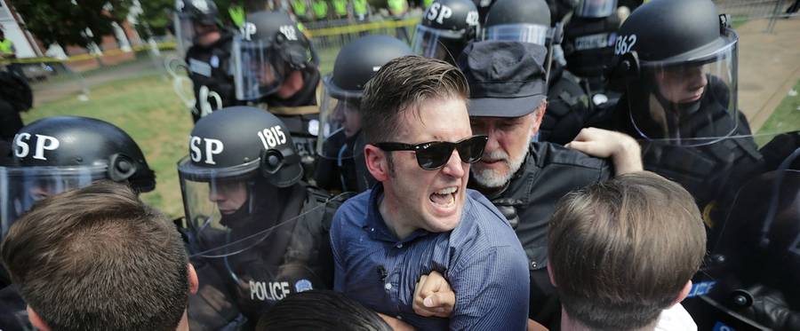 White nationalist Richard Spencer (C) and his supporters clash with Virginia State Police in Emancipation Park after the 'Unite the Right' rally was declared an unlawful gathering August 12, 2017 in Charlottesville, Virginia.