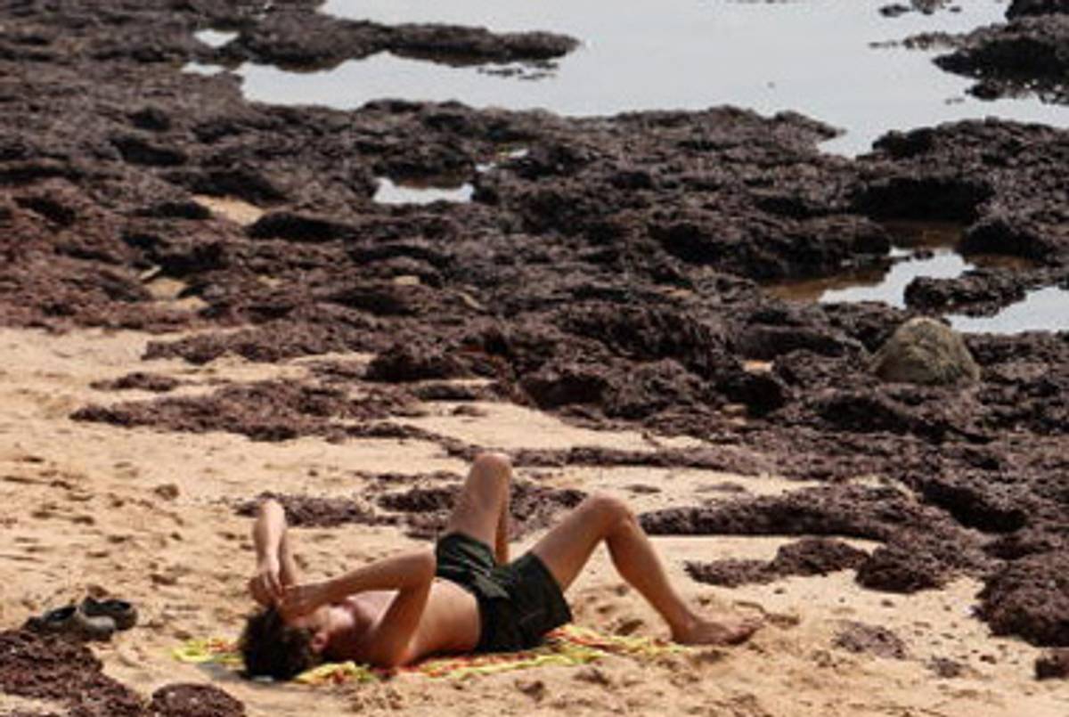 A tourist on Anjuna beach in Goa, India, last year.(Indranil Mukherjee/AFP/Getty Images)