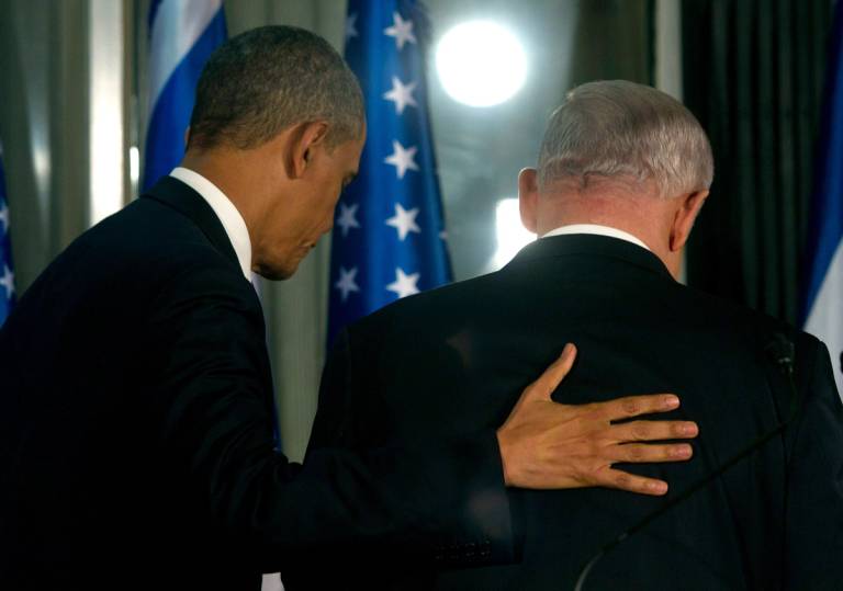 Barack Obama leaves with Israeli Prime Minister Benjamin Netanyahu following a press conference in Jerusalem on March 20, 2013 