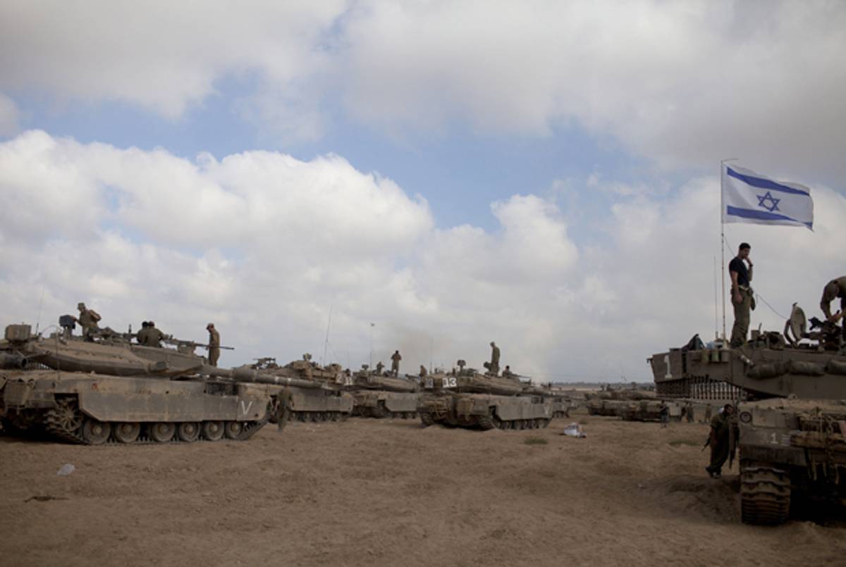 Israeli soldiers prepare their Tanks in a deployment area on July 24, 2014 on Israel's border with the Gaza Strip. (Lior Mizrahi/Getty Images)