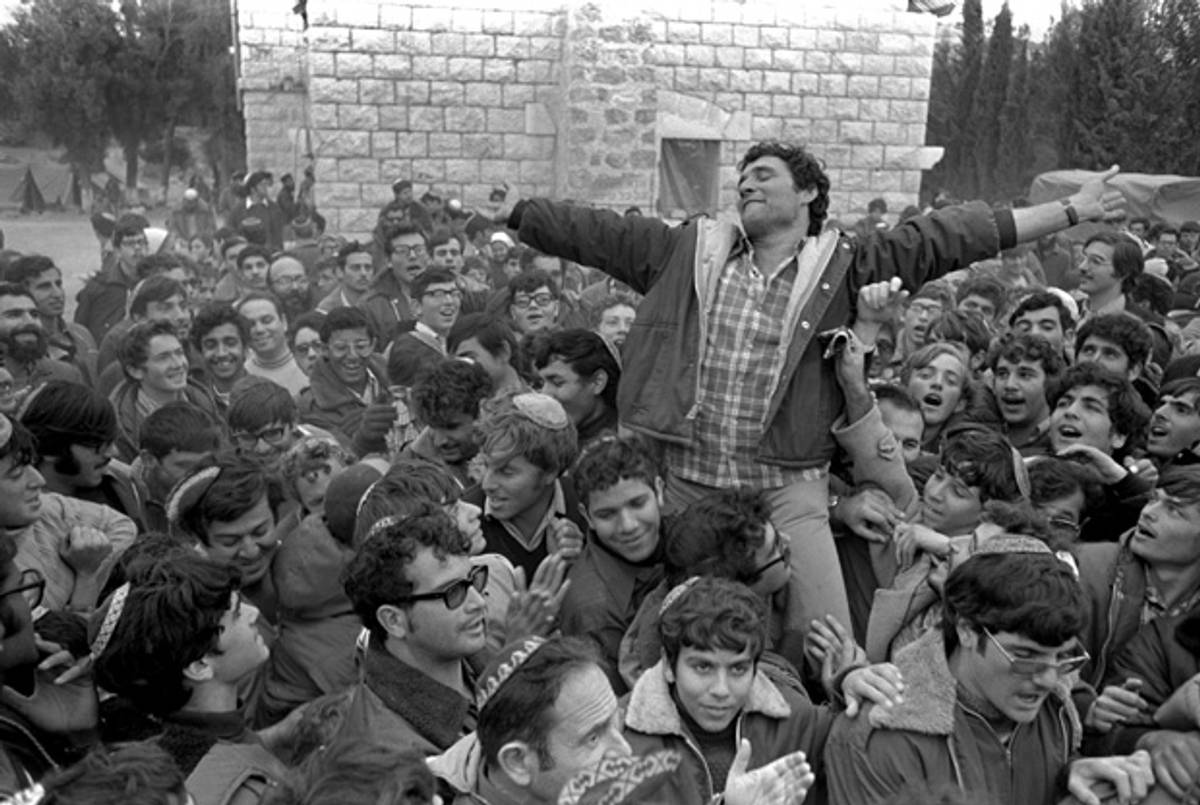 Right-wing Israeli settler leader Hanan Porat is carried by supporters as they celebrate the government's agreement to meet their demands to set up the first Jewish settlement in the Samaria Dec. 8, 1975, in their encampment at the Sebastia railway station in the northern West Bank.(Moshe Milner/GPO via Getty Images)