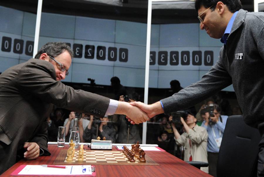 India's Viswanathan Anand (right) and Israel's Boris Gelfand shake hands before a World Chess Championship match in Moscow on May 18, 2012.(Kirill Kudryavtsev/AFP/Getty Images)