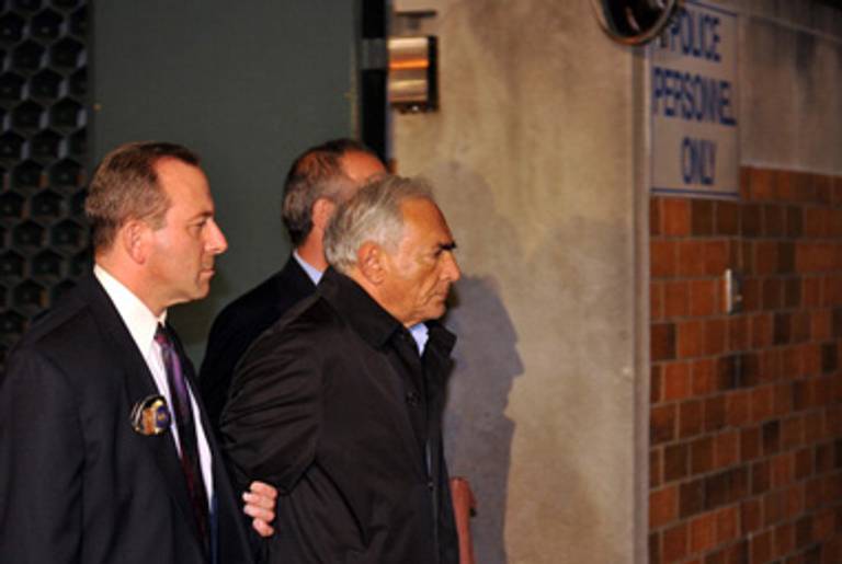 DSK yesterday outside a New York police station; he remains in custody.(Jewel Samad/AFP/Getty Images)