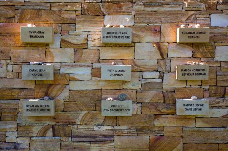 Legacy memorial plaques on a new stone wall at the Santa Fe Jewish Cemetery