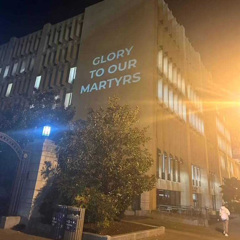 George Washington University's Gelman library on Tuesday, October 24. Four students projected a series of messages, including "Divestment from Zionist Genocide Now," and "Free Palestine from the River to the Sea"