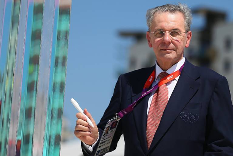 On July 23, IOC President Jacques Rogge signs the Peace Wall in the Athletes Village(Hannah Johnston/Getty Images)