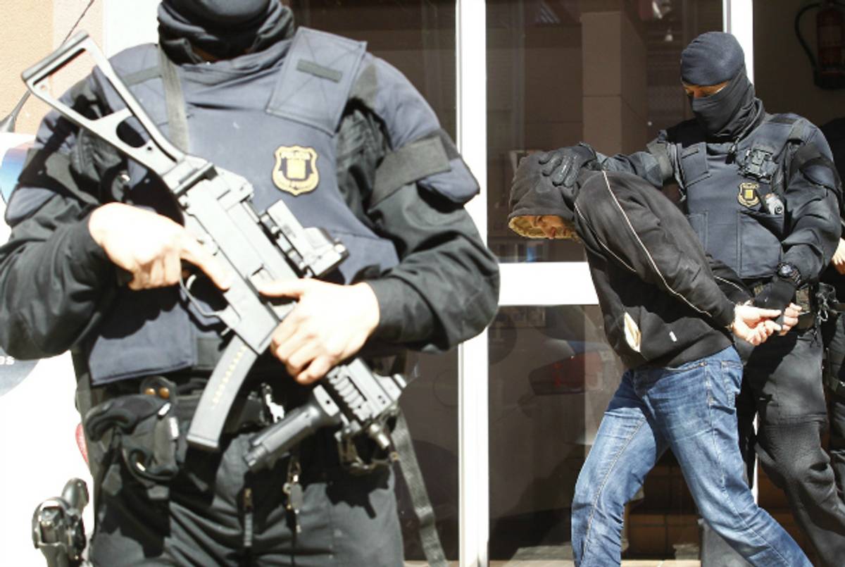 A man suspected of links to Islamic State is arrested in Spain on April 8, 2015. (Quique Garcia/AFP/Getty Images)