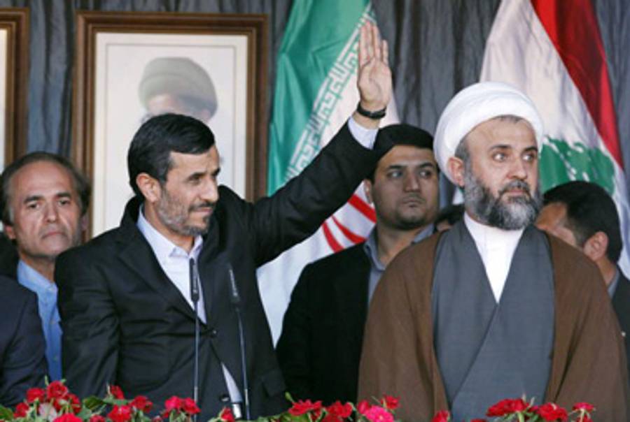 Ahmadinejad speaking yesterday; next to him is a Hezbollah representative.(Salah Malkawi/Getty Images)