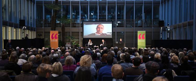 Author Kamel Daoud speaks via Skype during a reading at the Lit.Cologne international literature festival in Cologne, Germany, 13 March 2016.