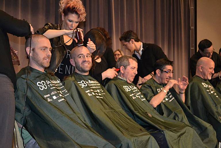 Rabbis Scott Weiner, Ben David, Eric J. Siroka, and Paul Kipnes get their heads shaved in Chicago on Tuesday, April 1. (Photo courtesy of Julie Pelc Adler)
